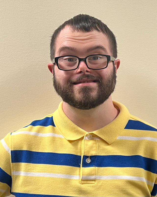 man with beard, glasses, smiling