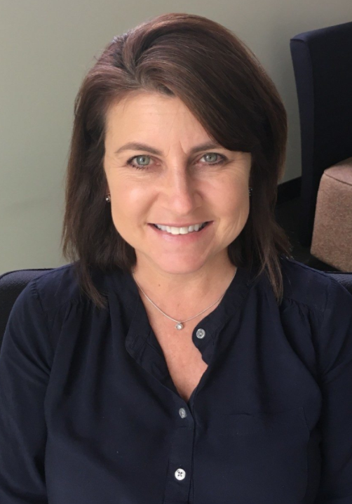 Woman with short dark hair, smiling